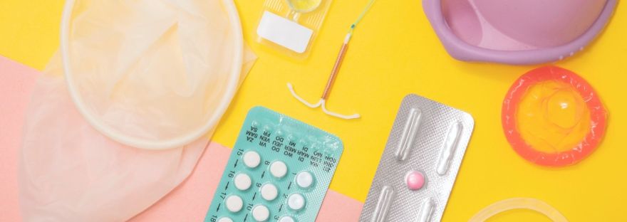 picture of different birth controls like a condom, contraceptive pill
